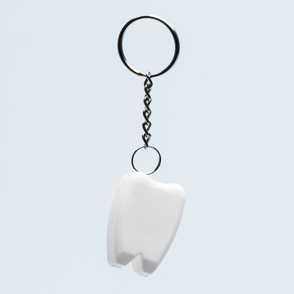 Toothy keychain with dental floss