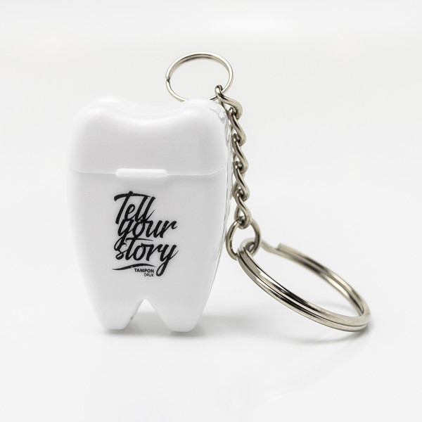 Toothy keychain with dental floss