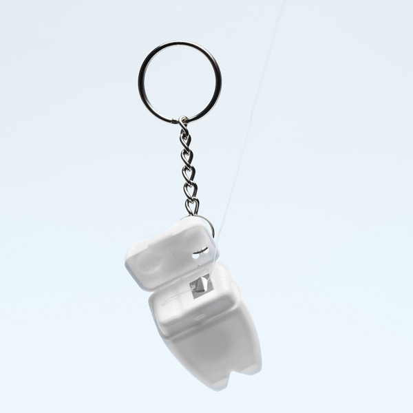 Toothy keychain with dental floss