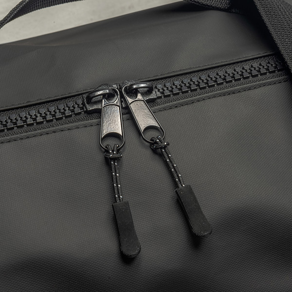 Water Resistant Polyester Duffle Bag. Adjustable And Removable Shoulder Strap With Buckle