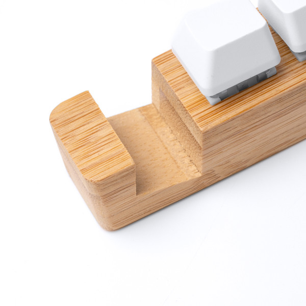 Personalised bamboo keyring with smartphone stand and anti-stress function